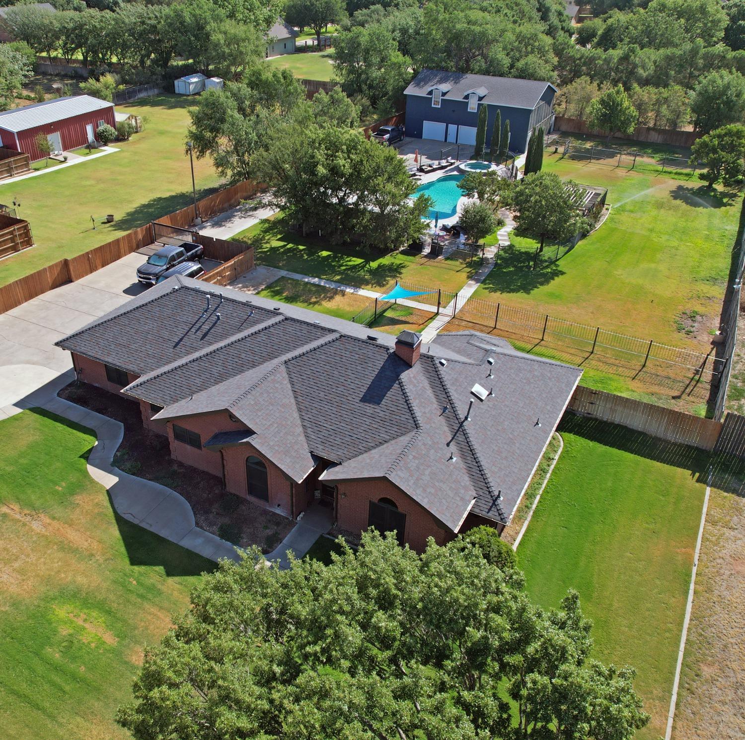 an aerial view of a house with a garden