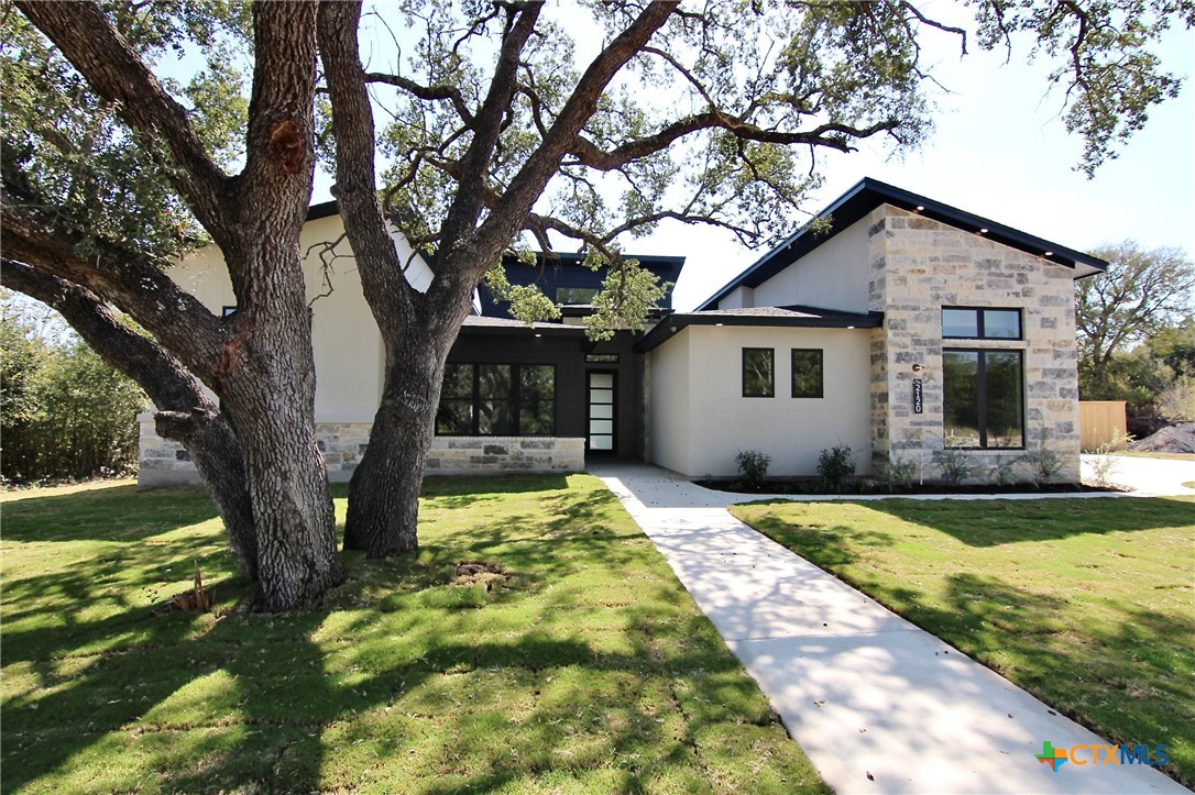 a house view with a garden space