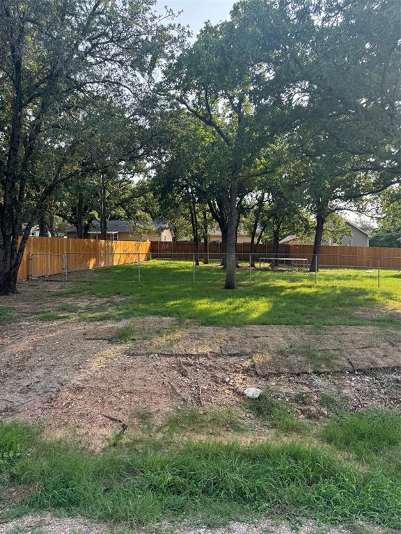 a view of a backyard with green space