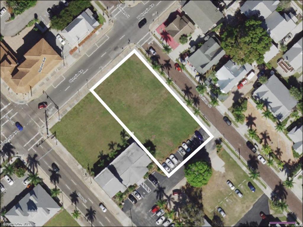 an aerial view of a residential houses with outdoor space