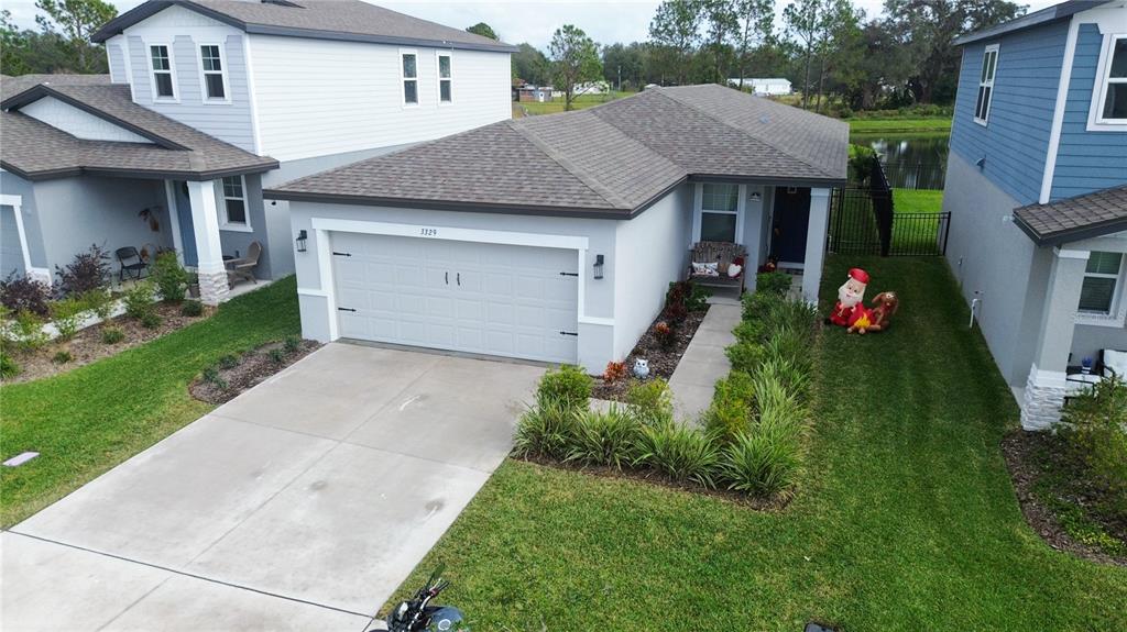 a aerial view of a house with swing and plants