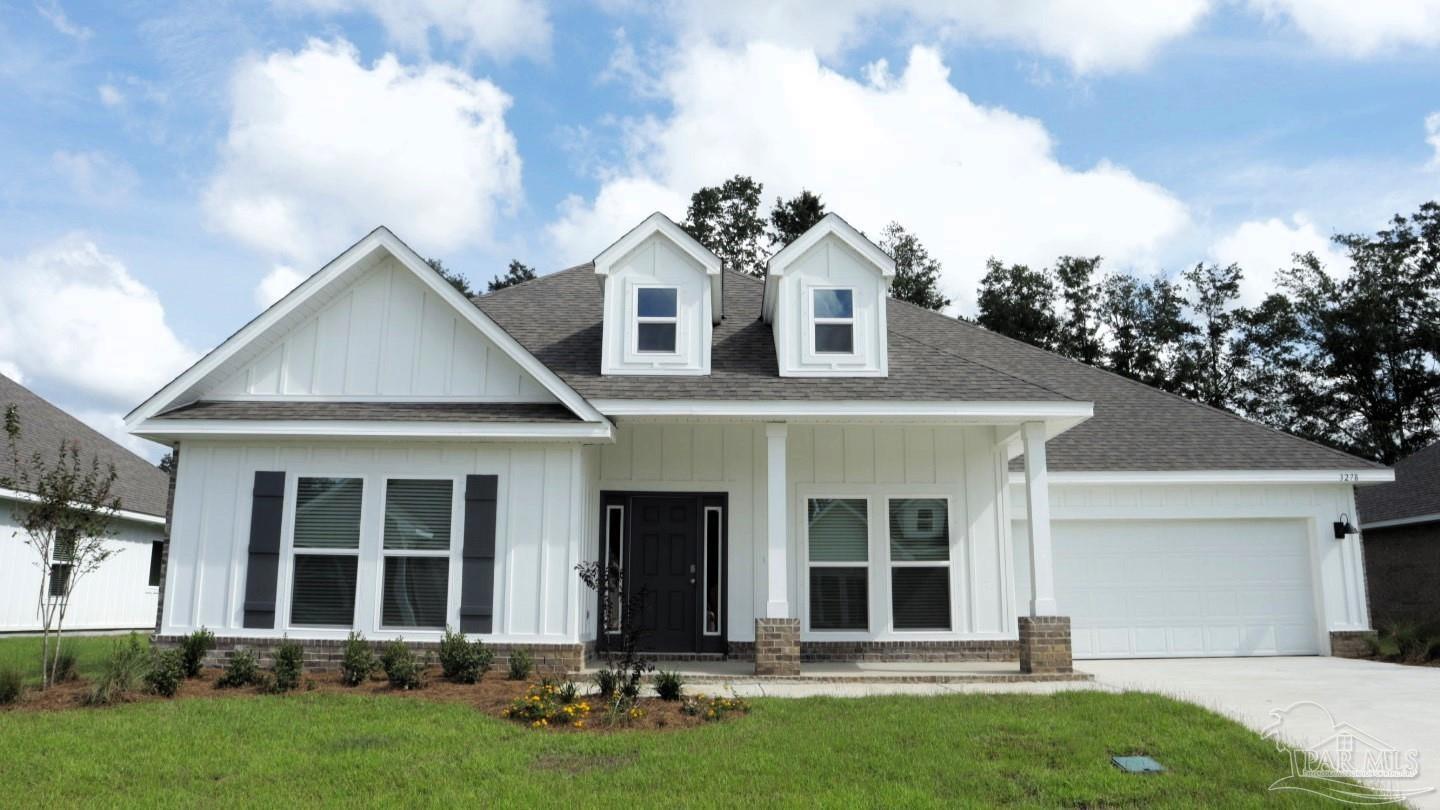 front view of a house with a yard