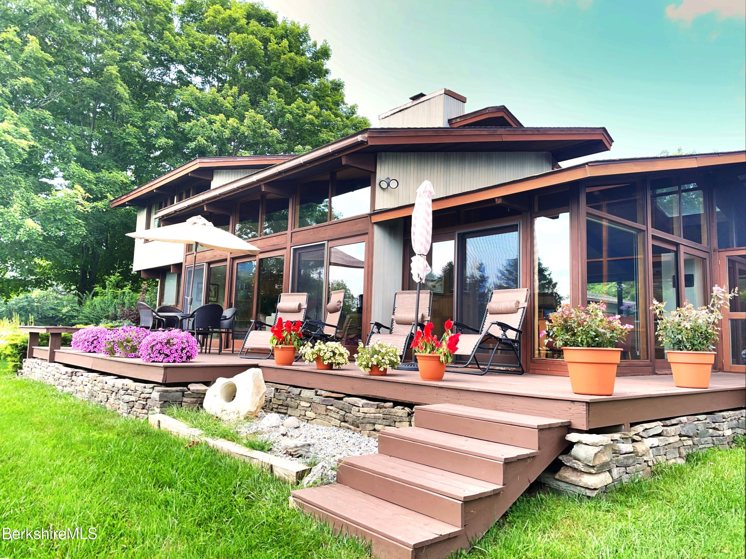 a view of an chairs and tables in patio