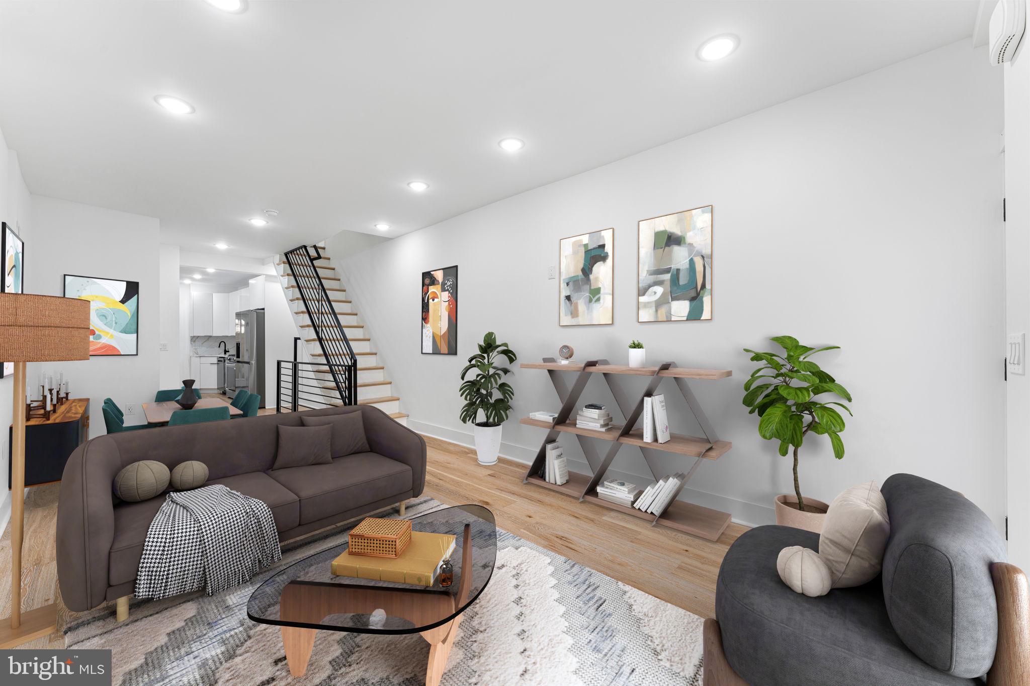 a living room with furniture and a potted plant