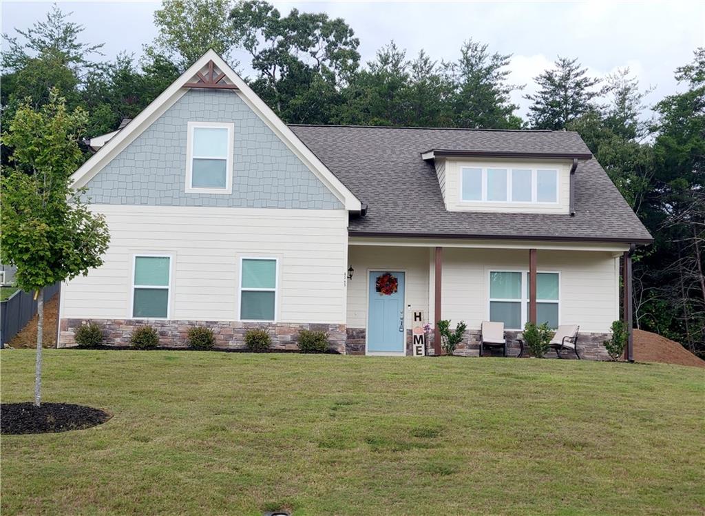 a front view of a house with a yard