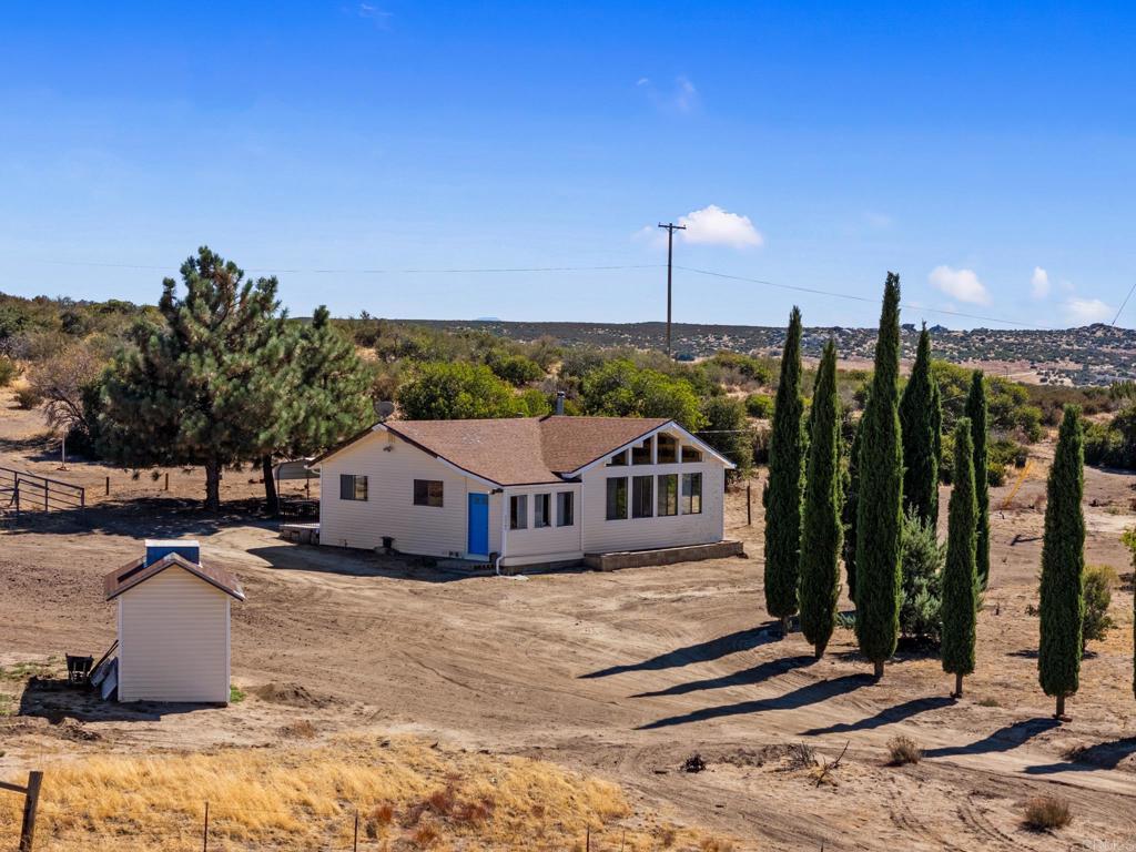 a view of a house with a swimming pool