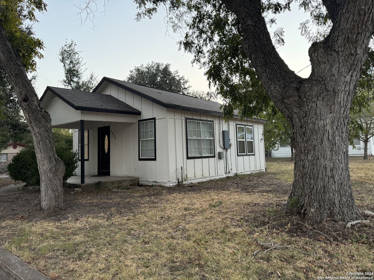 a view of a house with a tree and a tree