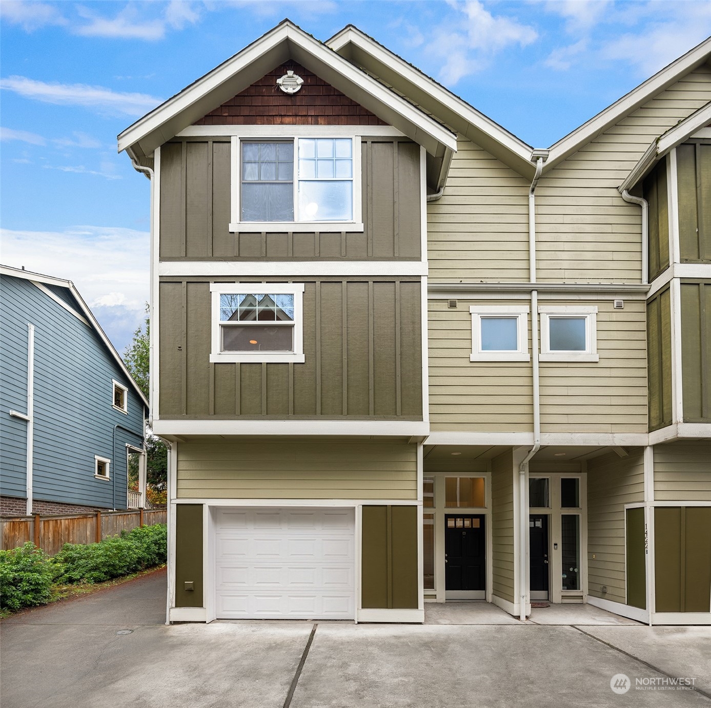 a front view of a house with a garage