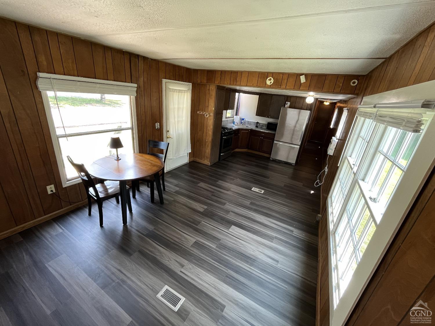 a view of a room with furniture window and wooden floor