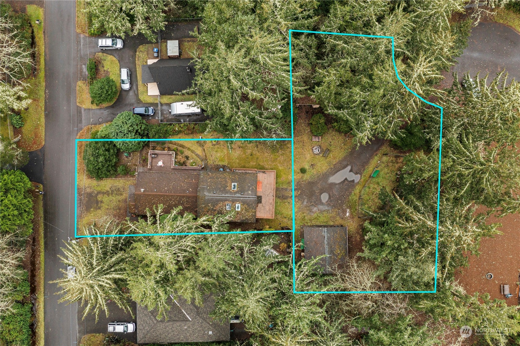 an aerial view of a house with a yard