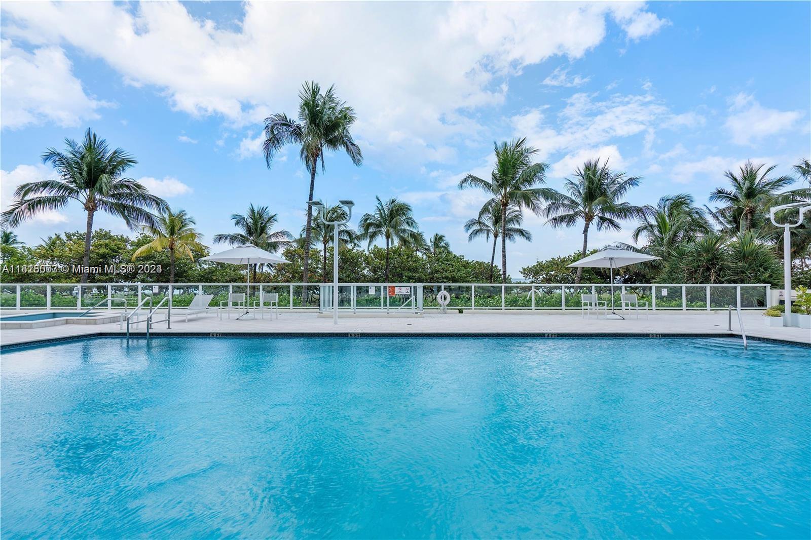 a view of a swimming pool and a lake