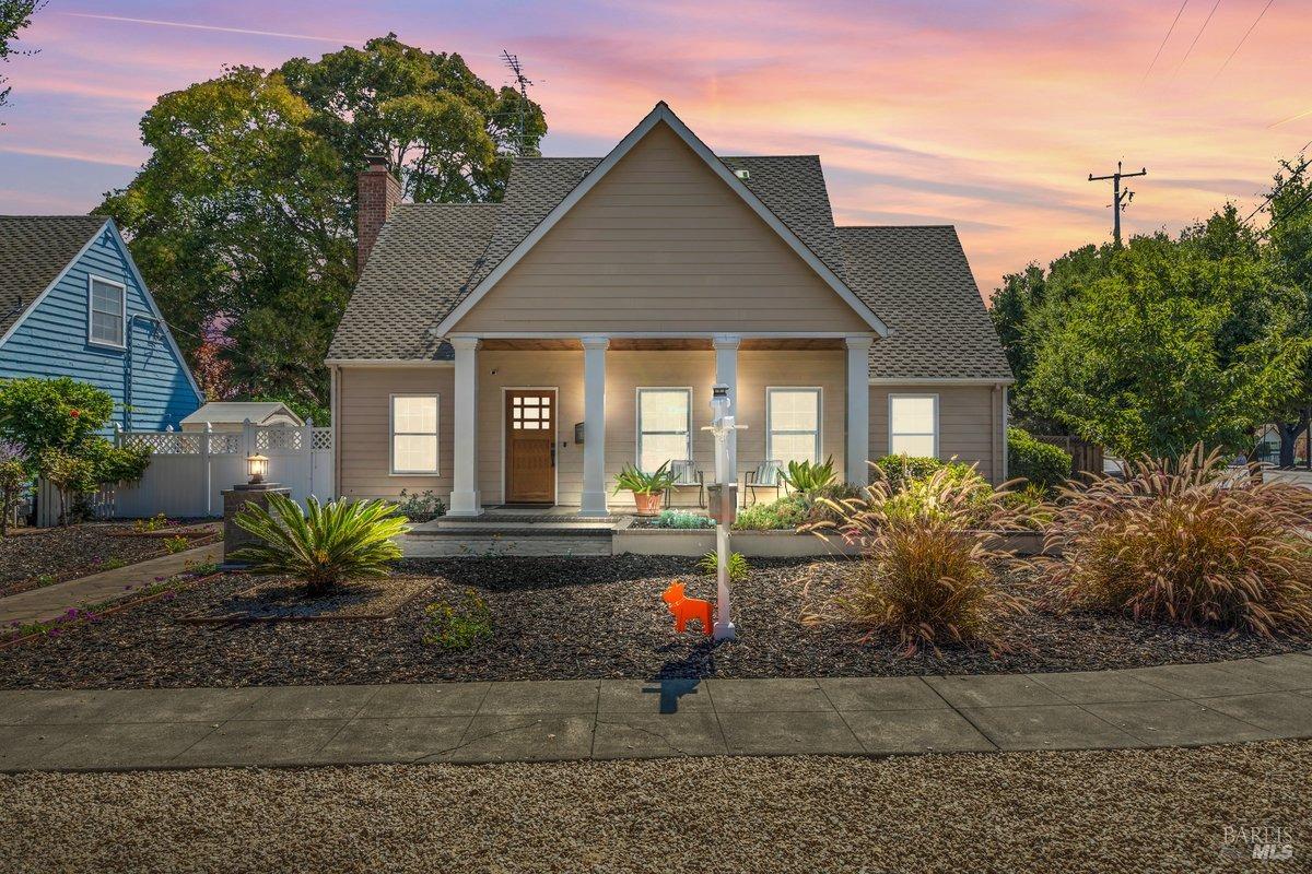 a front view of a house with garden