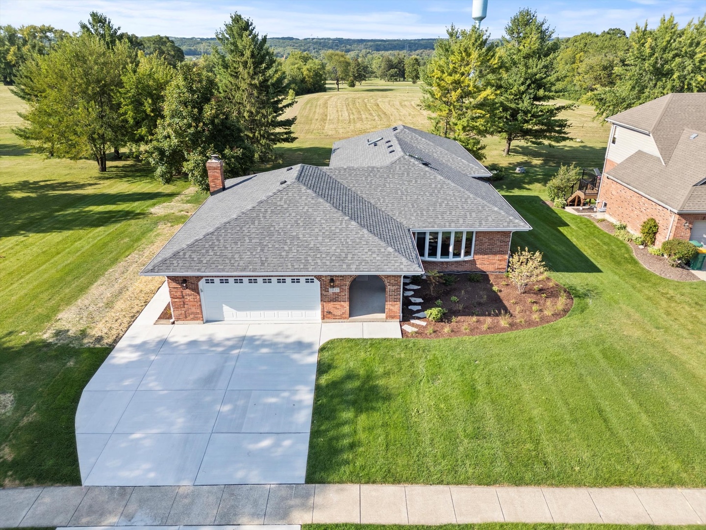 a aerial view of a house with a yard