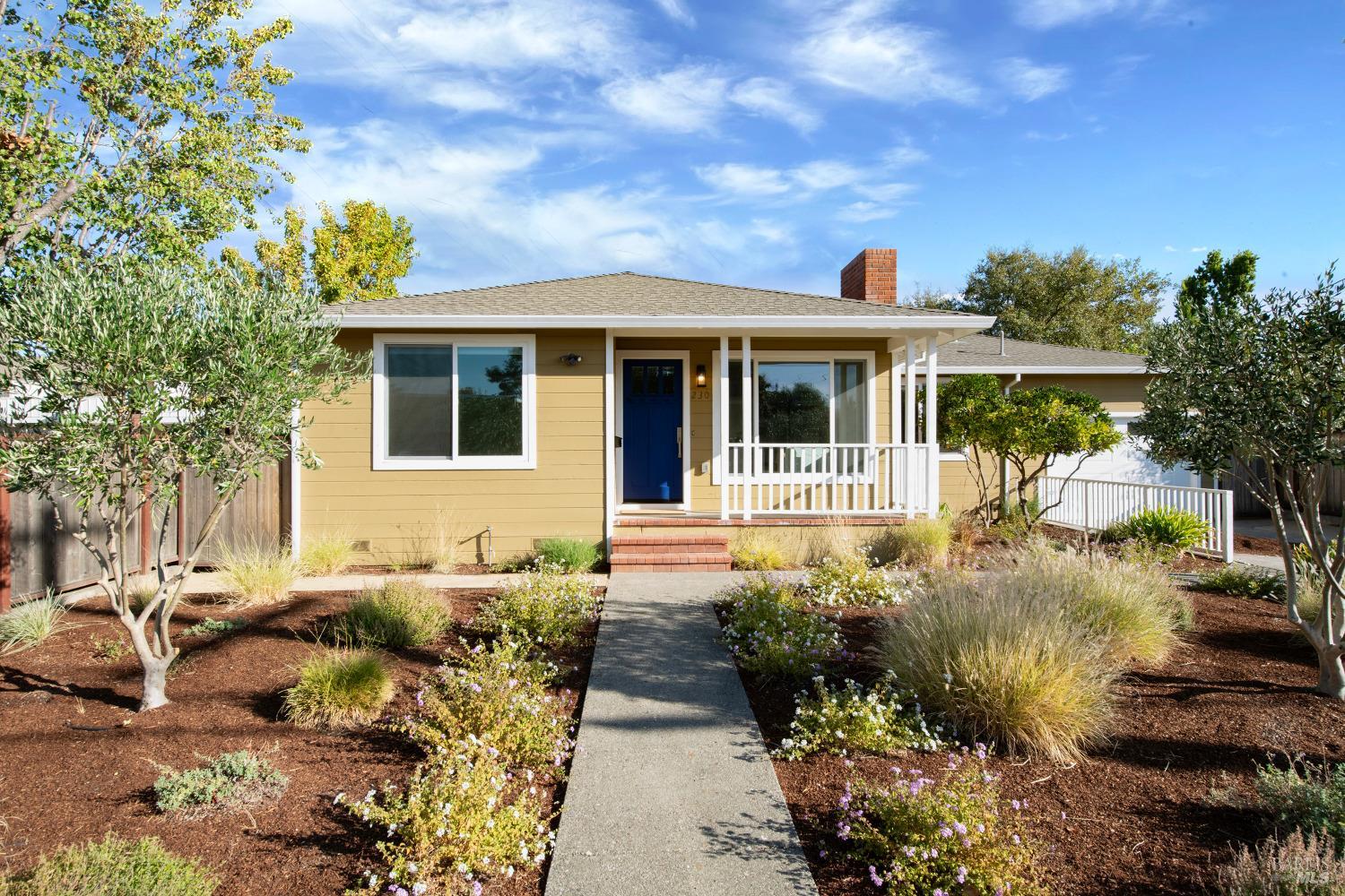 a front view of a house with garden