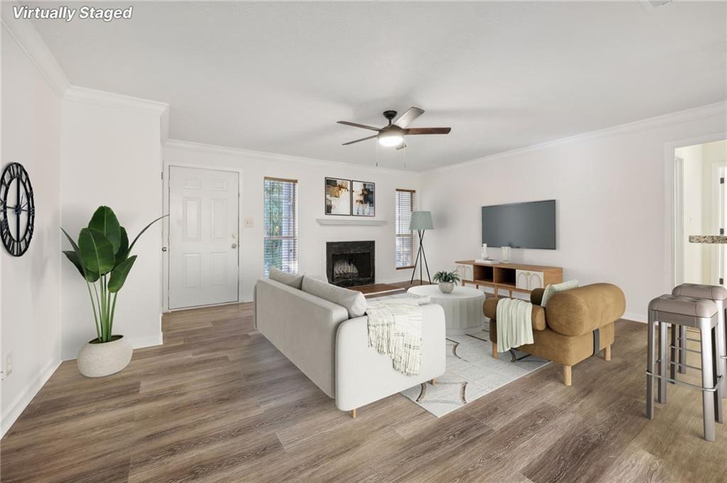 a living room with furniture fireplace and flat screen tv