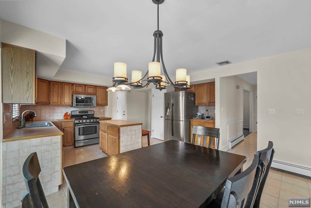 a view of kitchen island with furniture and wooden floor