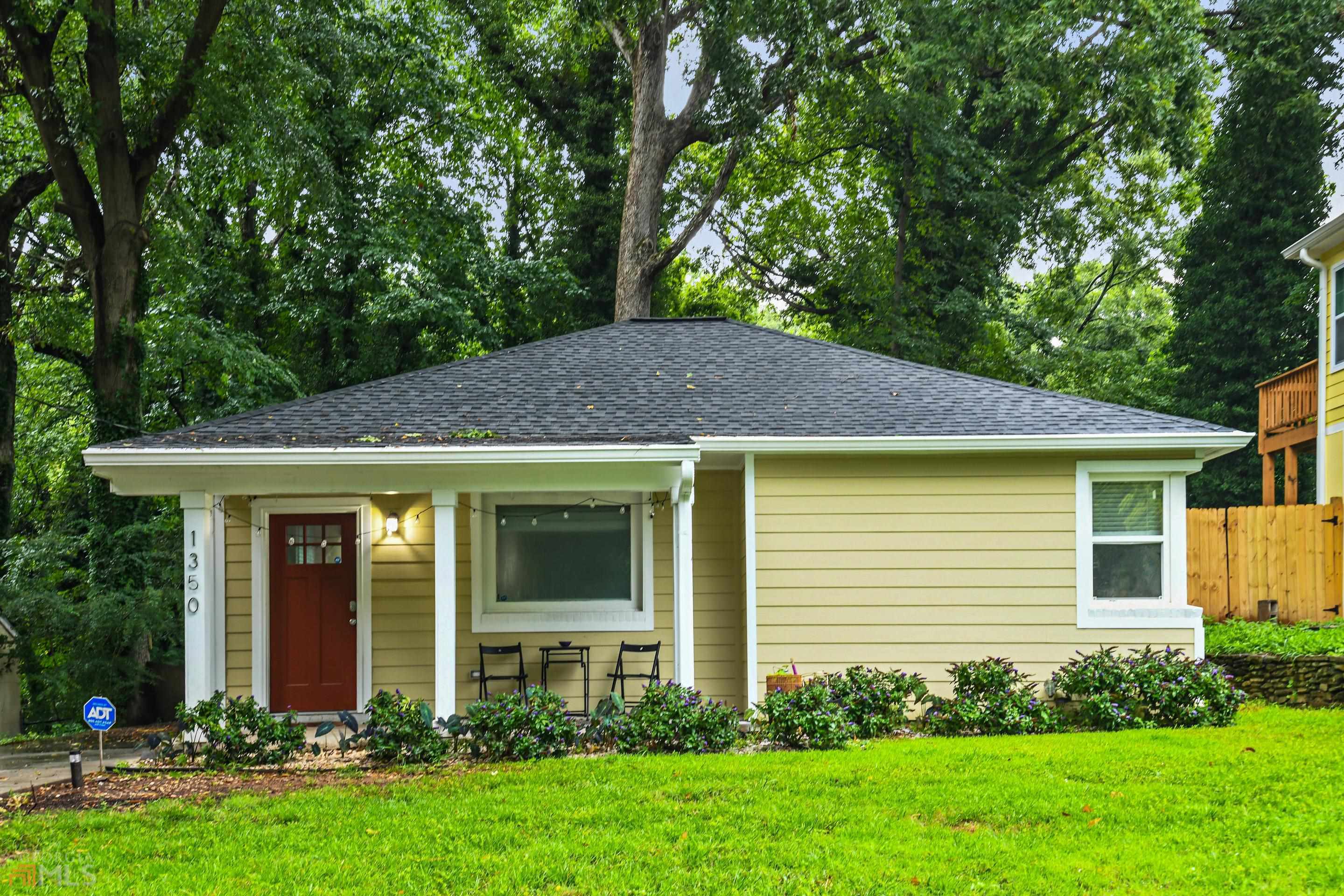 a view of a house with garden and yard