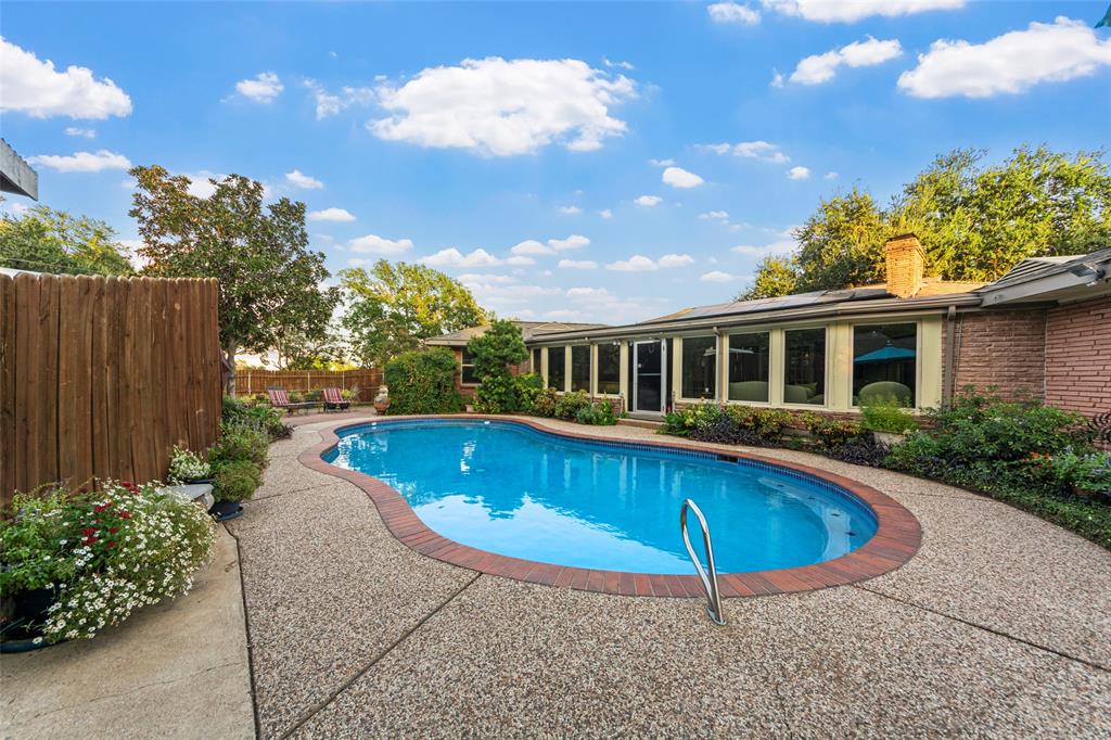 a view of a house with swimming pool