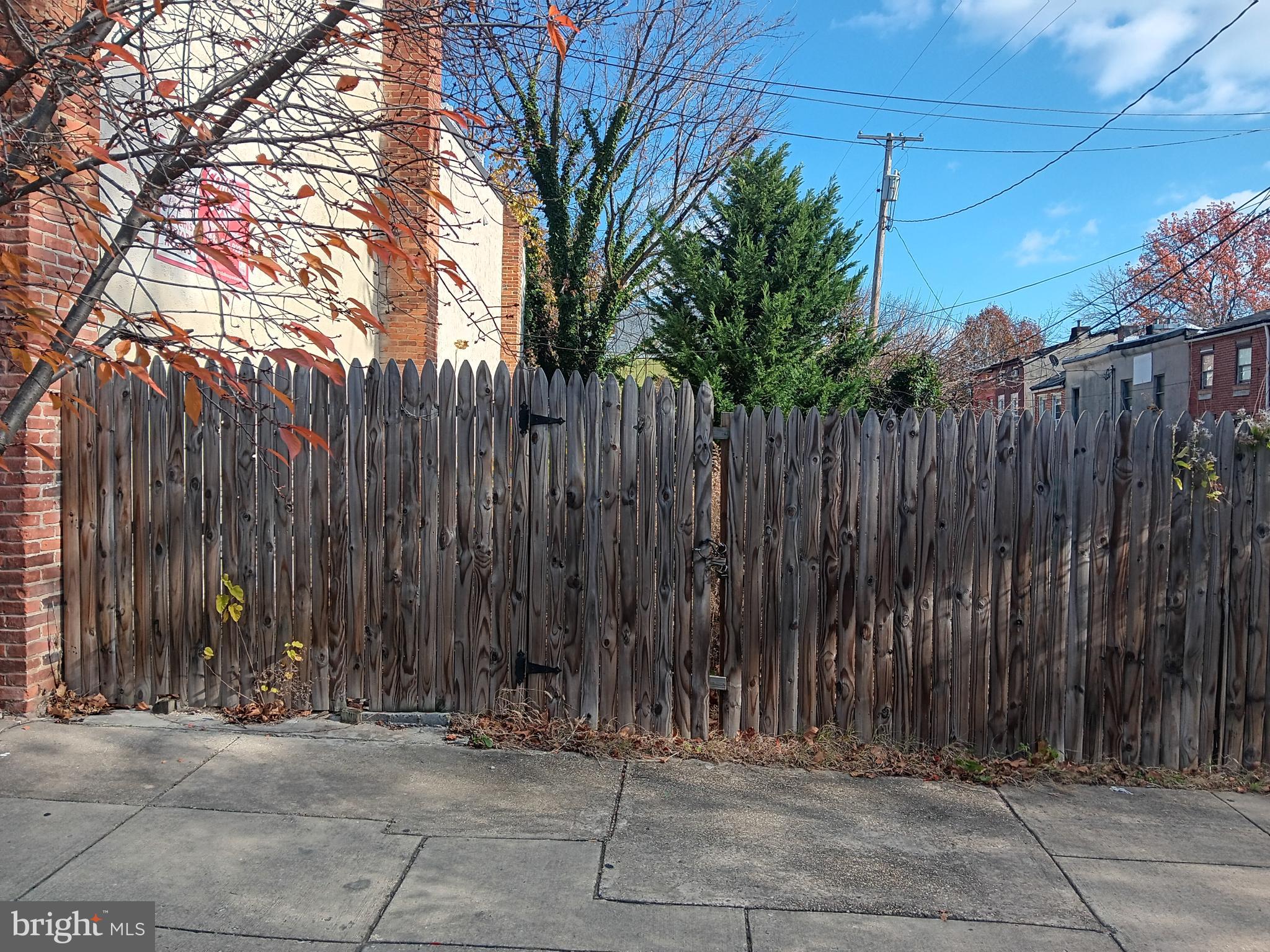 a view of outdoor space with a wooden fence