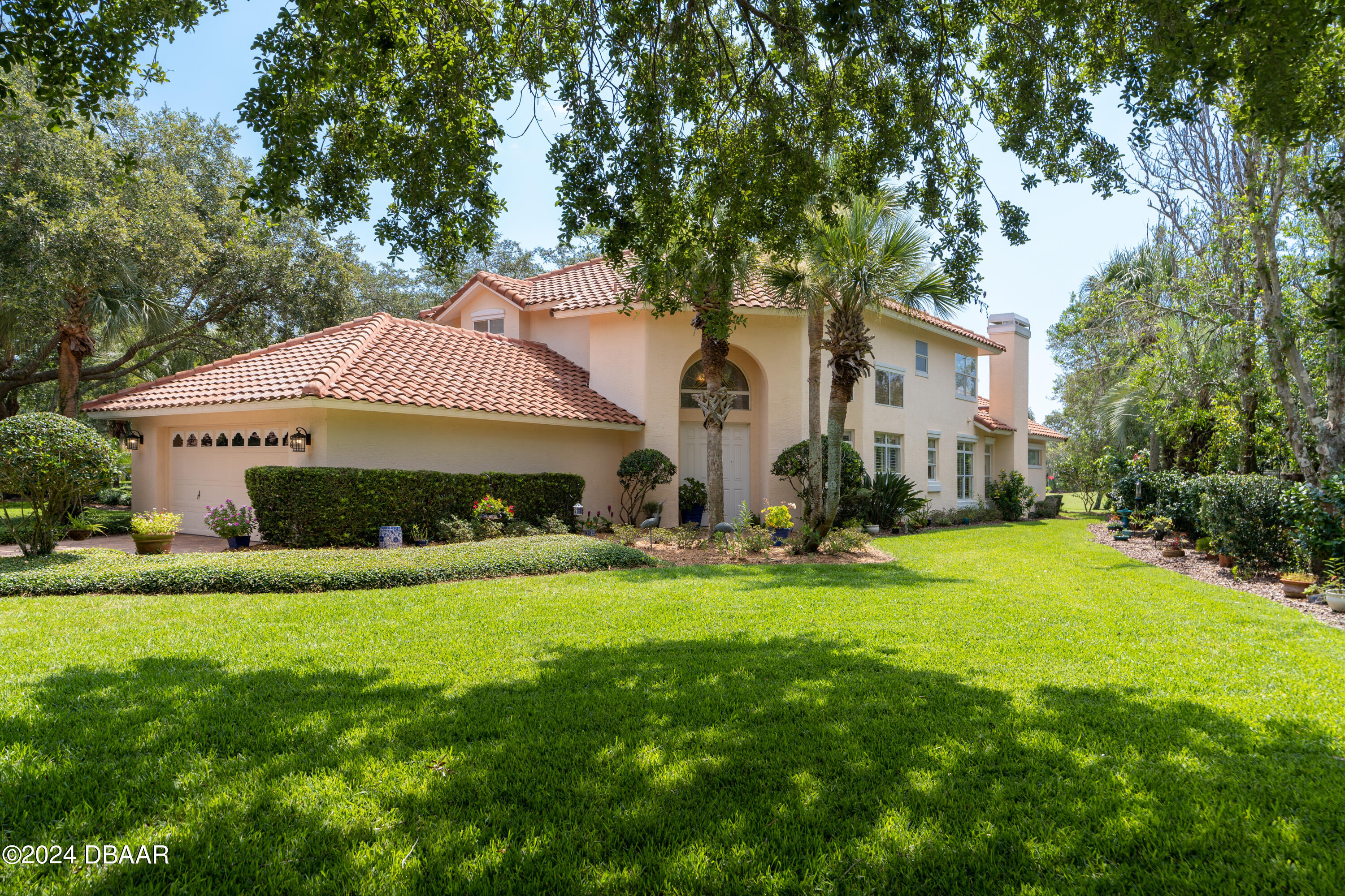 a front view of house with yard and green space