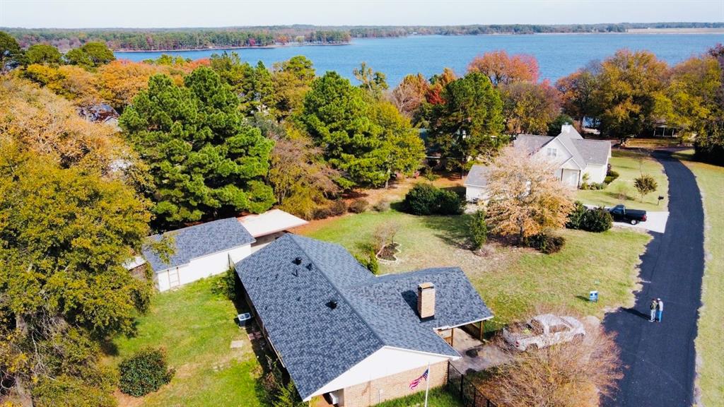 an aerial view of a house with a swimming pool