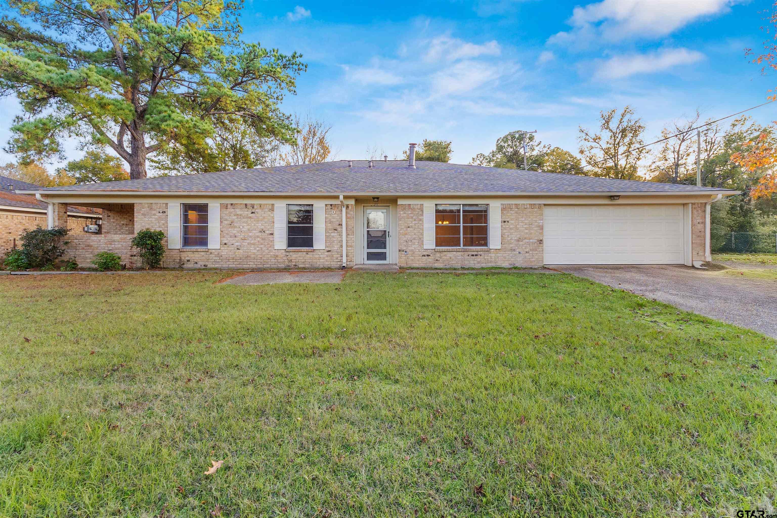 front view of a house with a yard