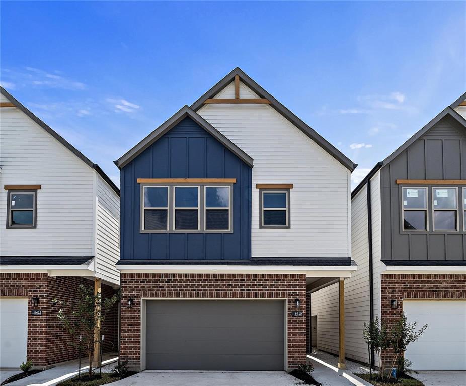 a front view of a house with a garage