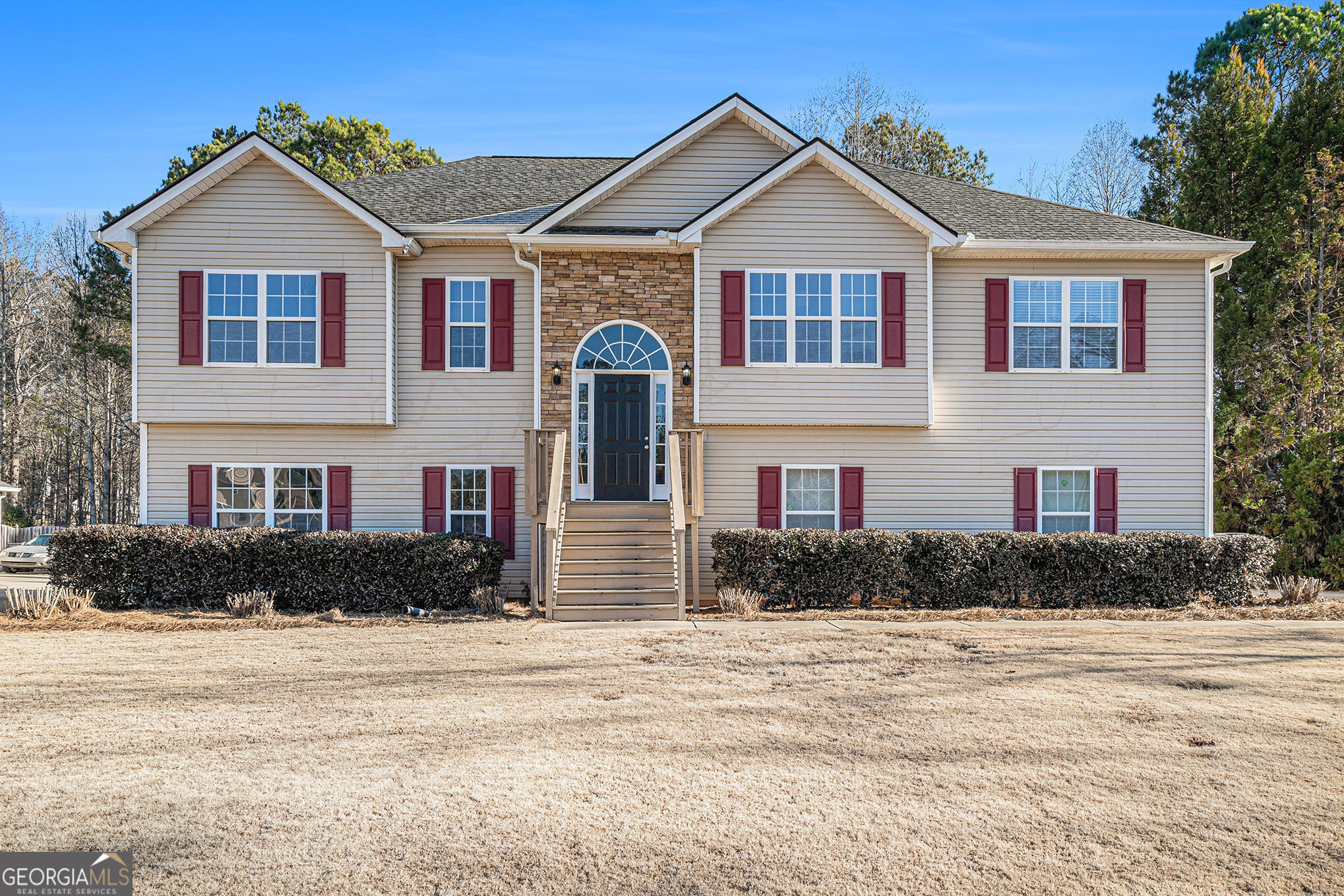 a front view of a house with a yard