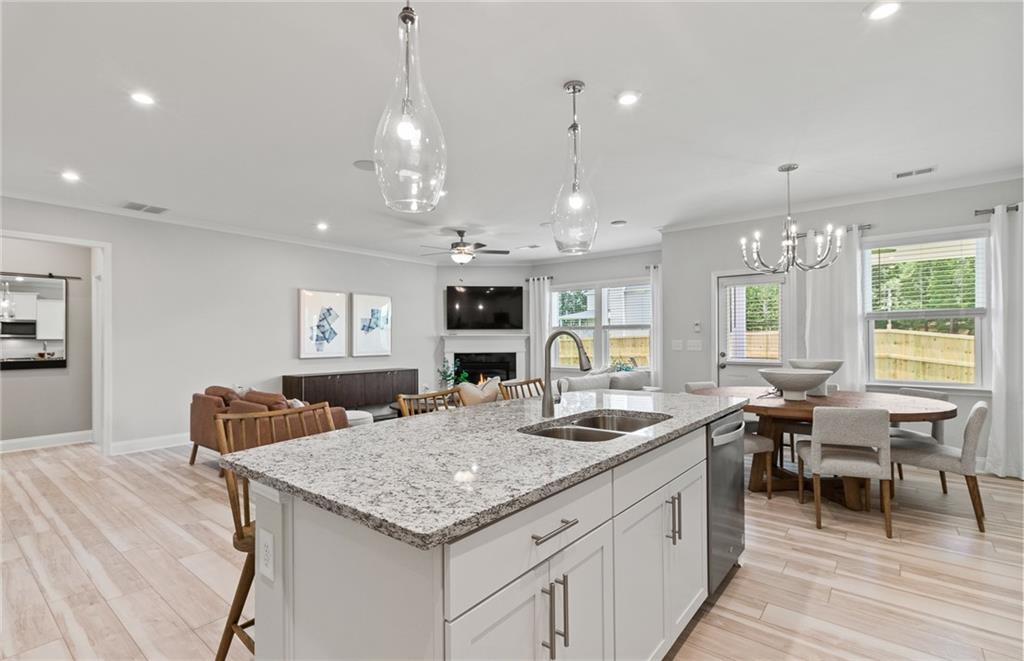 a kitchen with center island table and chairs in it