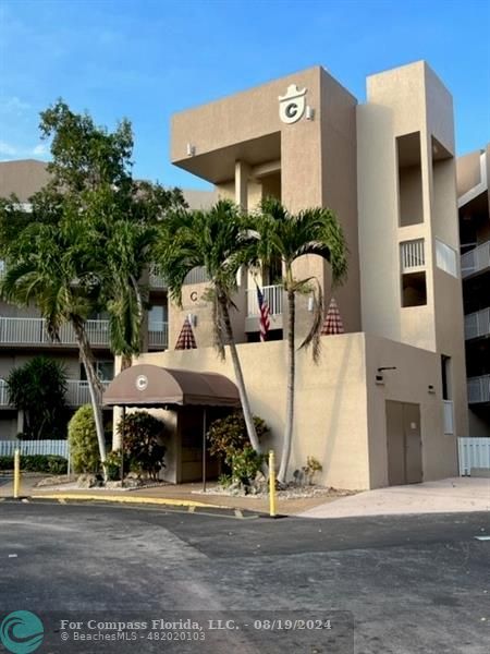 a front view of a building with street view