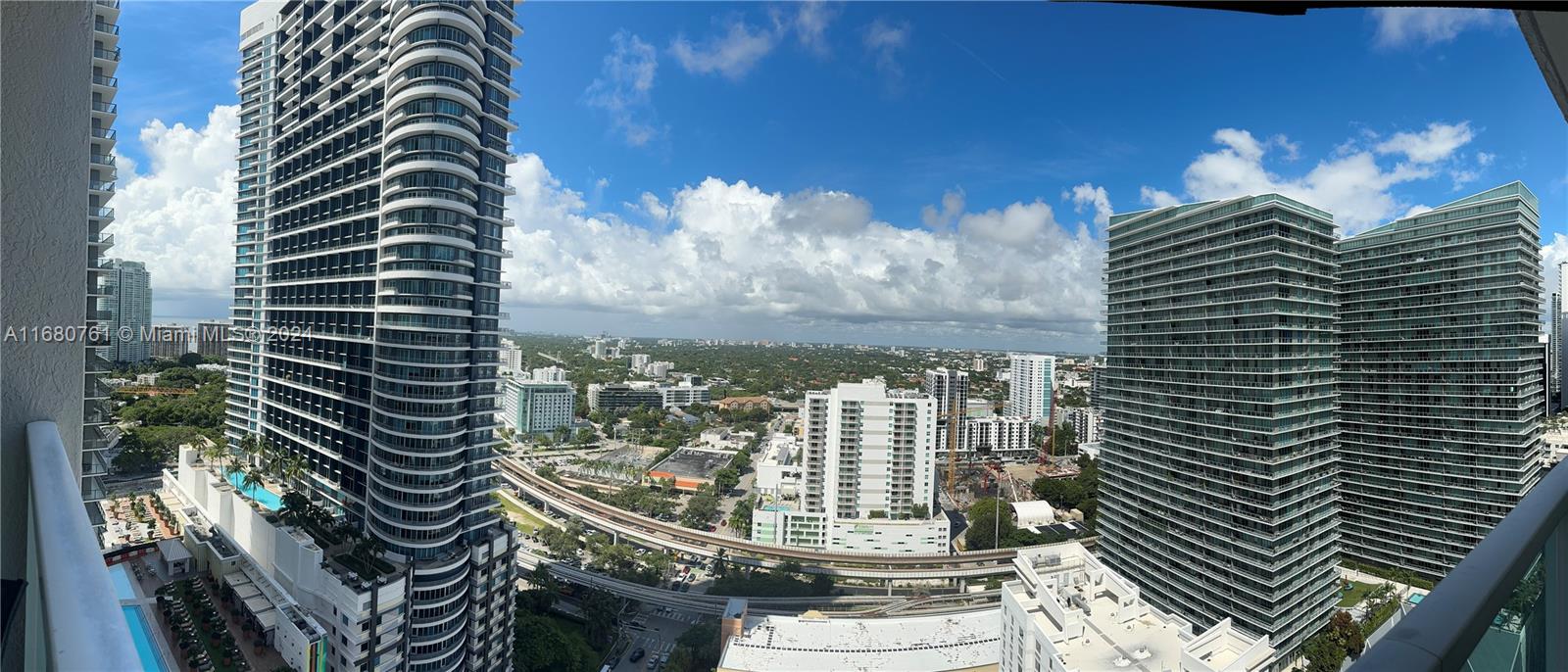 a view of a balcony with next to a road