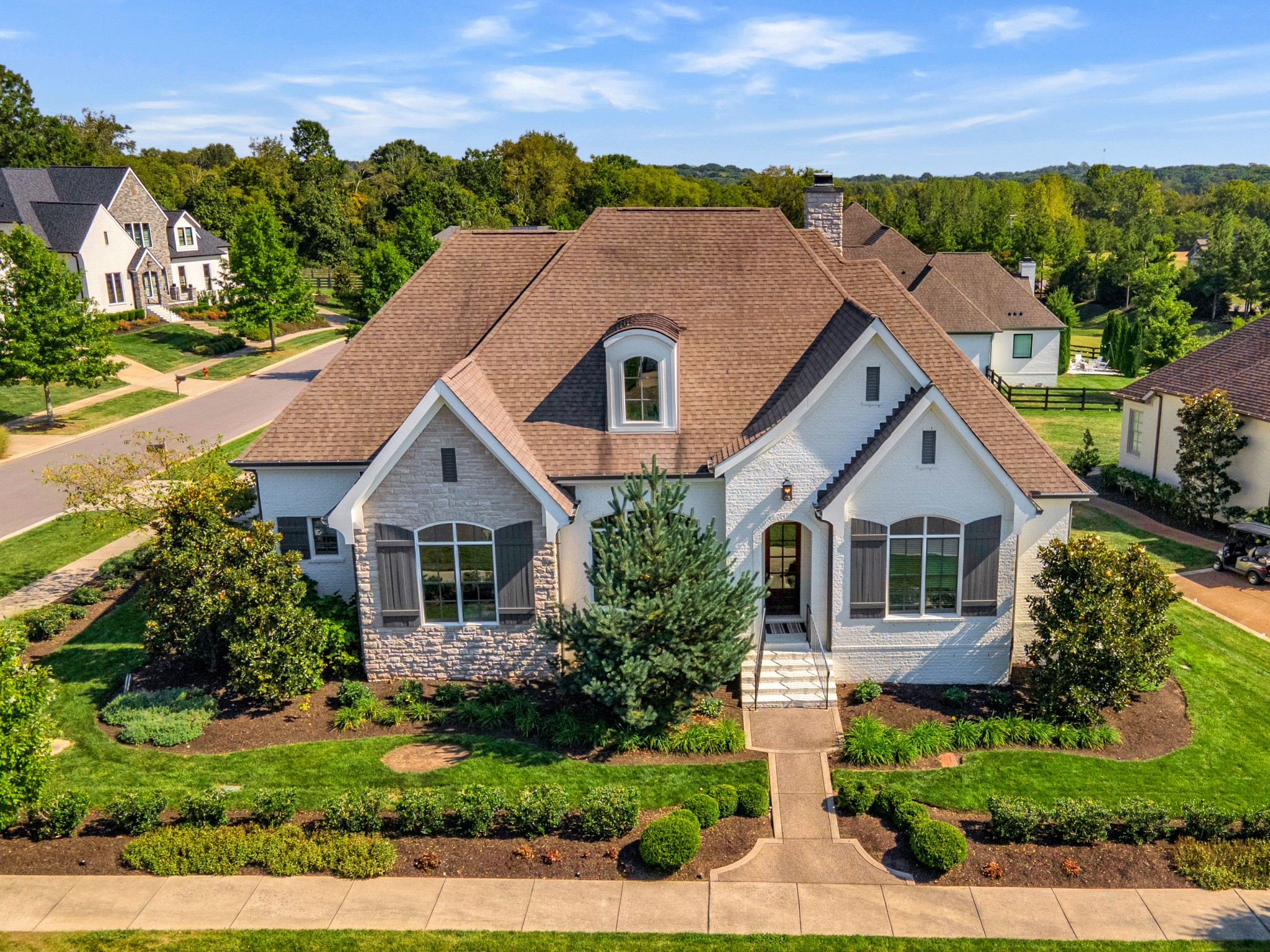 front view of a house with a yard