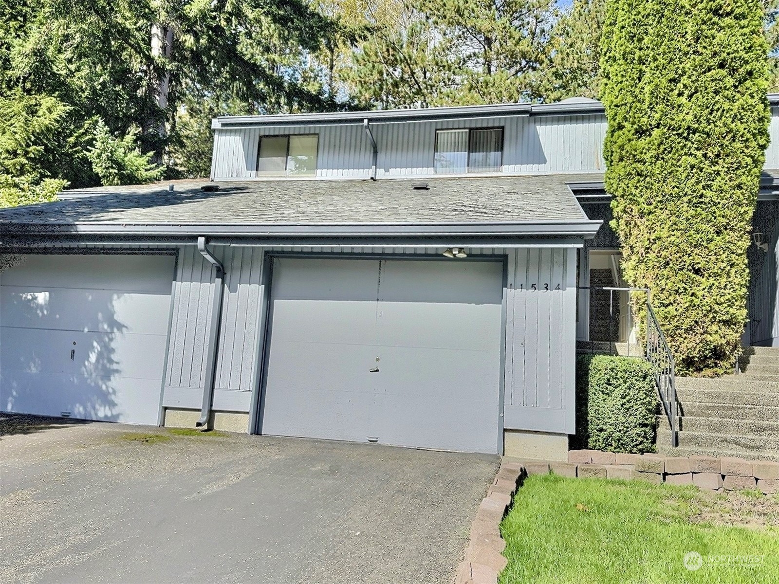 a front view of a house with garage