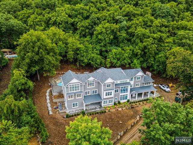 an aerial view of a house with a garden