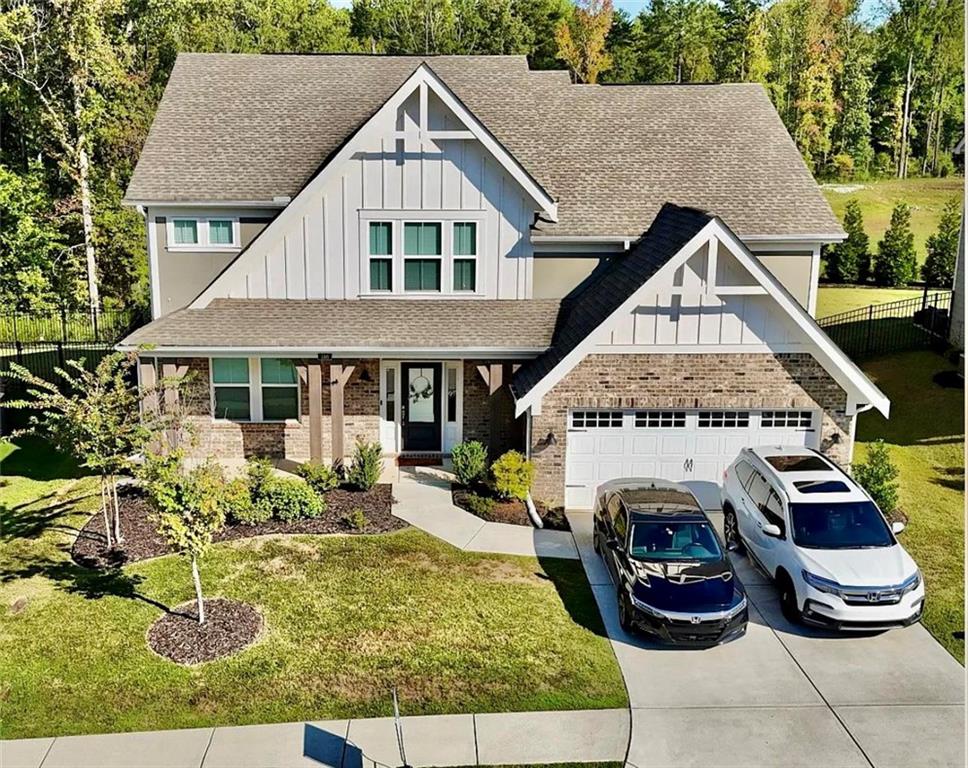 a front view of a house with a yard balcony