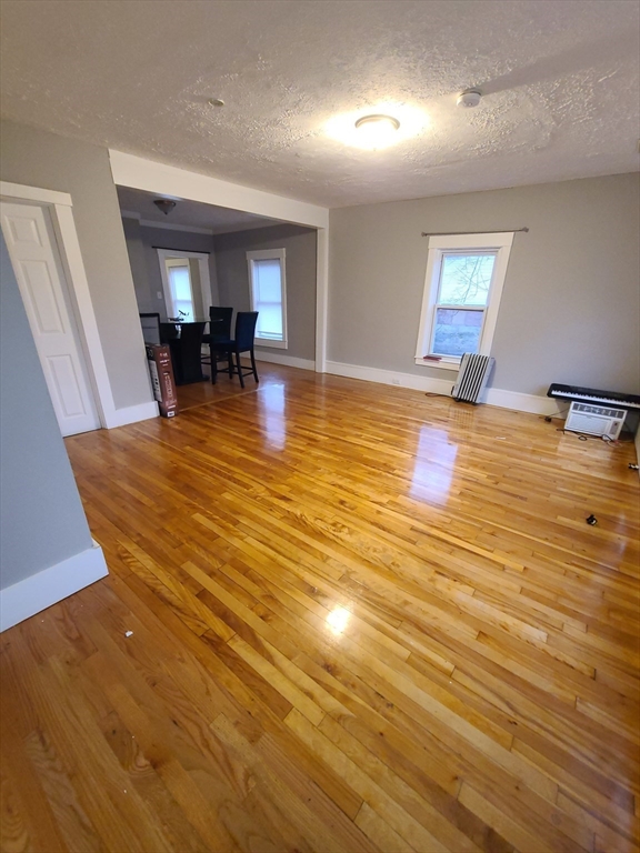 a view of a living room and kitchen with furniture