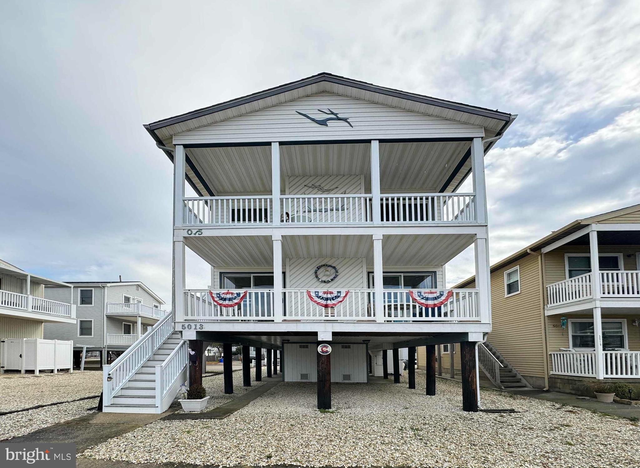 a roof deck with a table and chairs