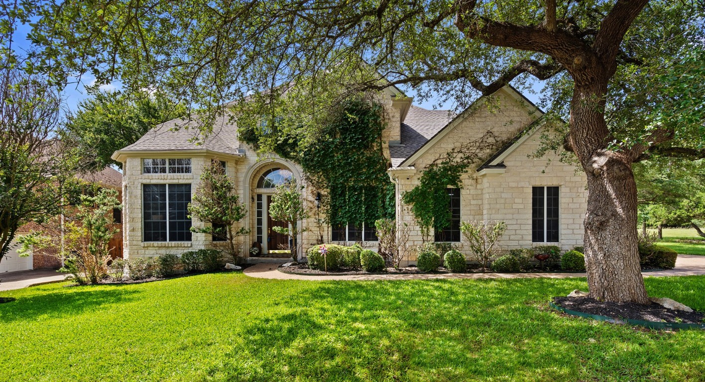 front view of a house with a yard