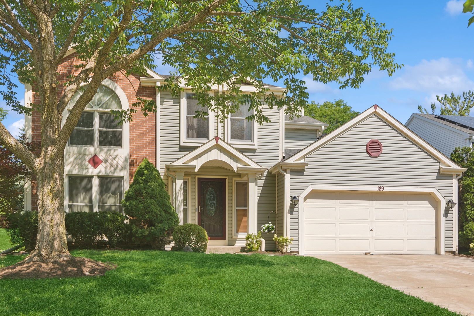 front view of a house with a yard