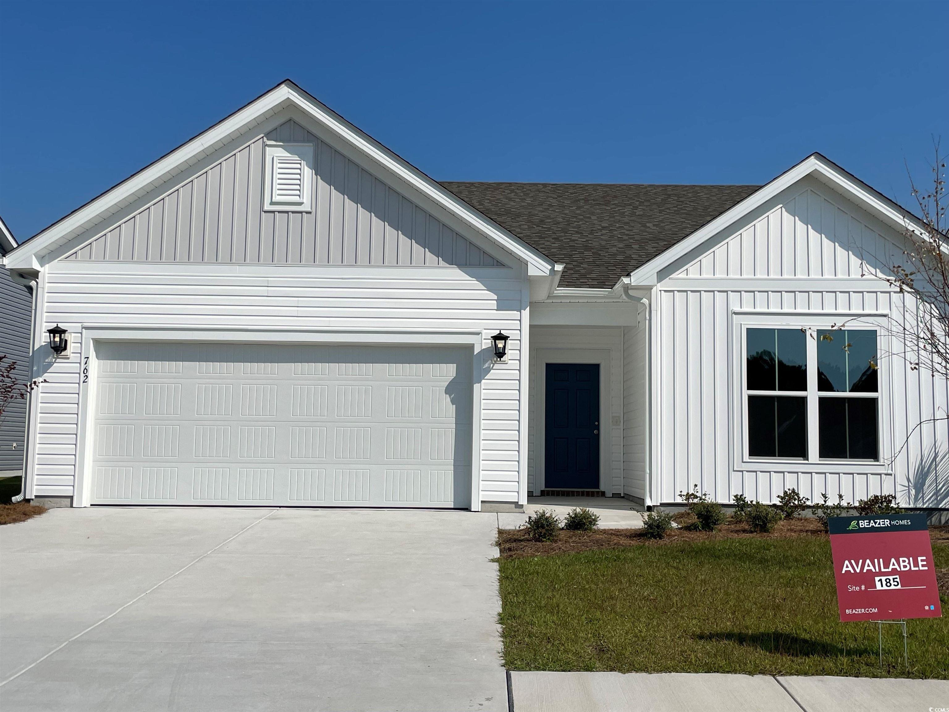 View of front of house featuring a garage and a fr