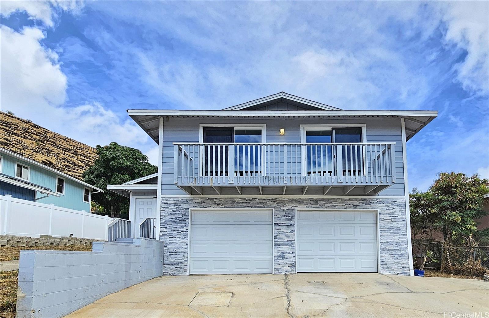 a front view of a house with garage