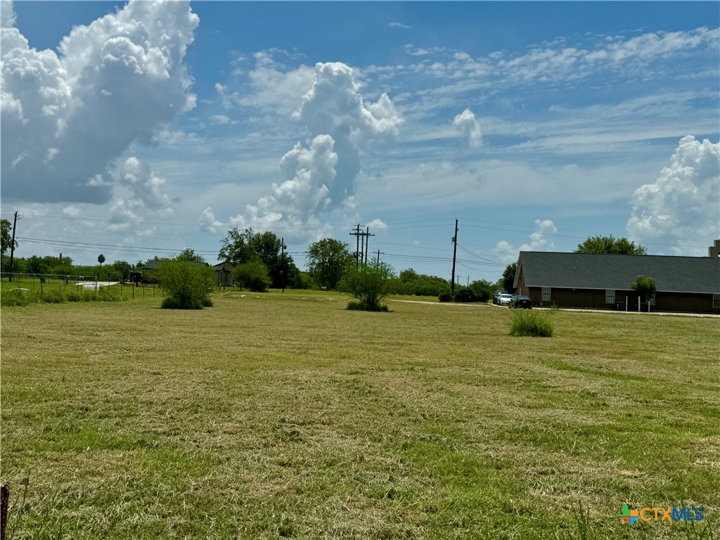 a tall building in the middle of a field