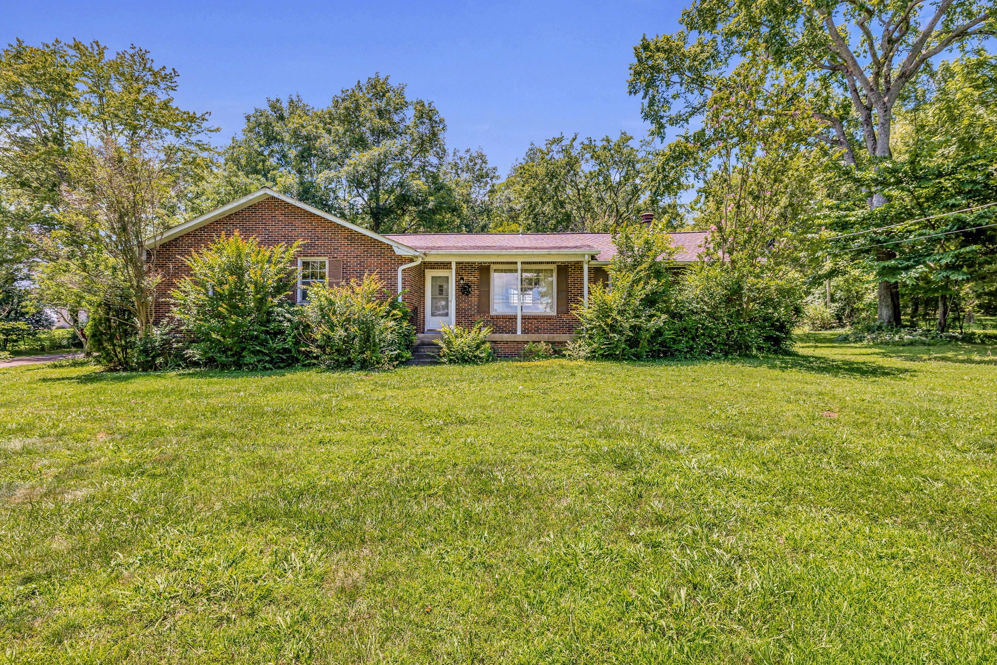 a view of house with yard