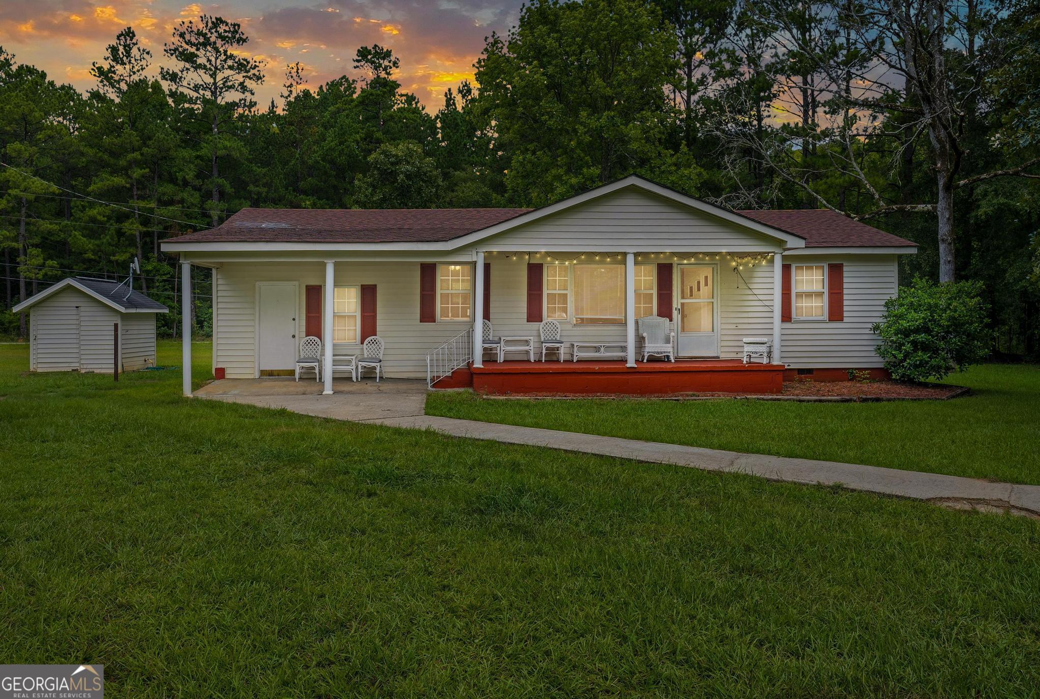 a front view of a house with a yard and porch