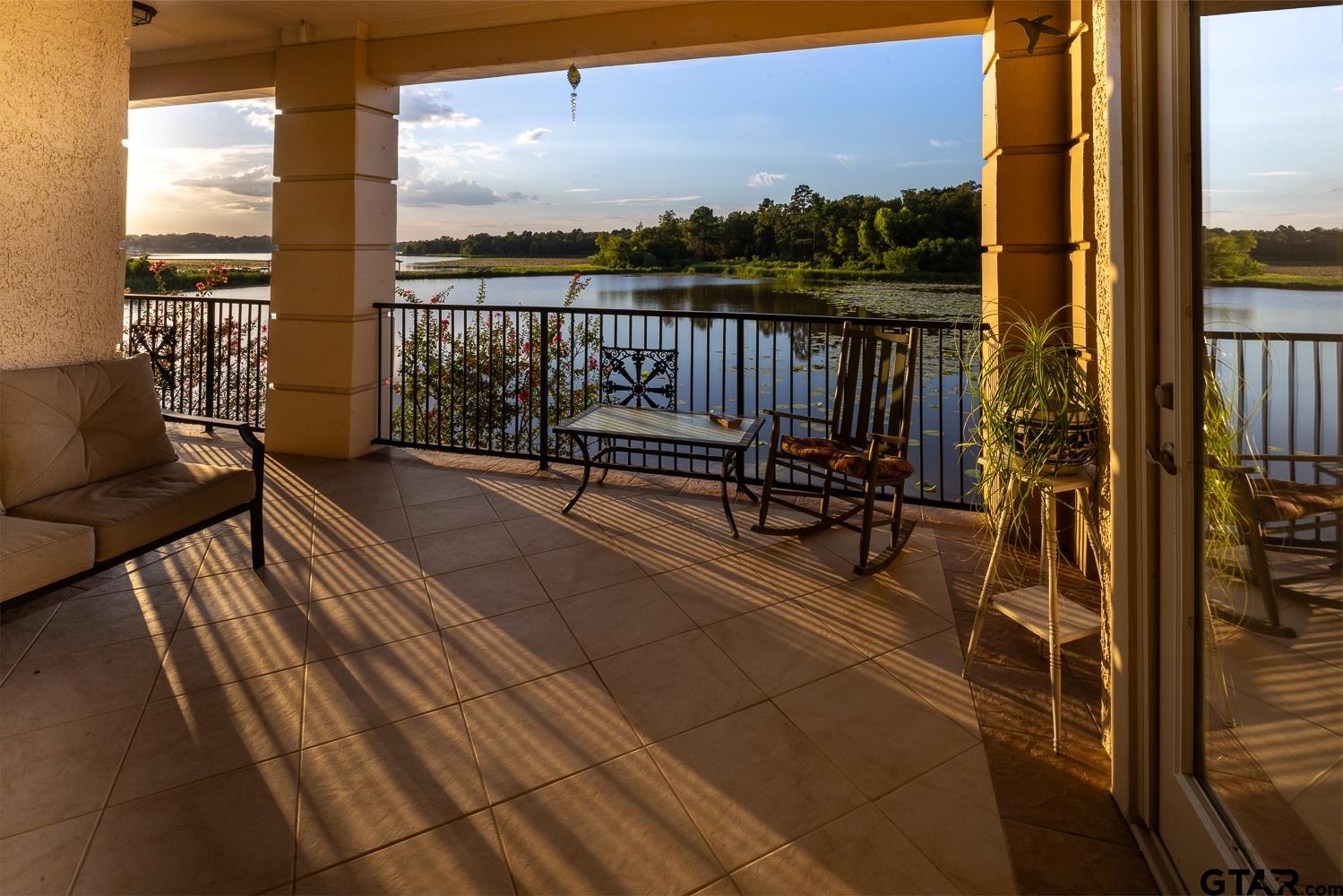 a view of balcony with chairs