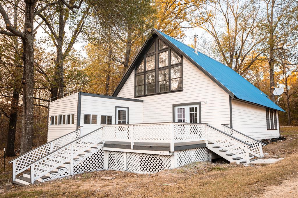 a view of a house with a bench