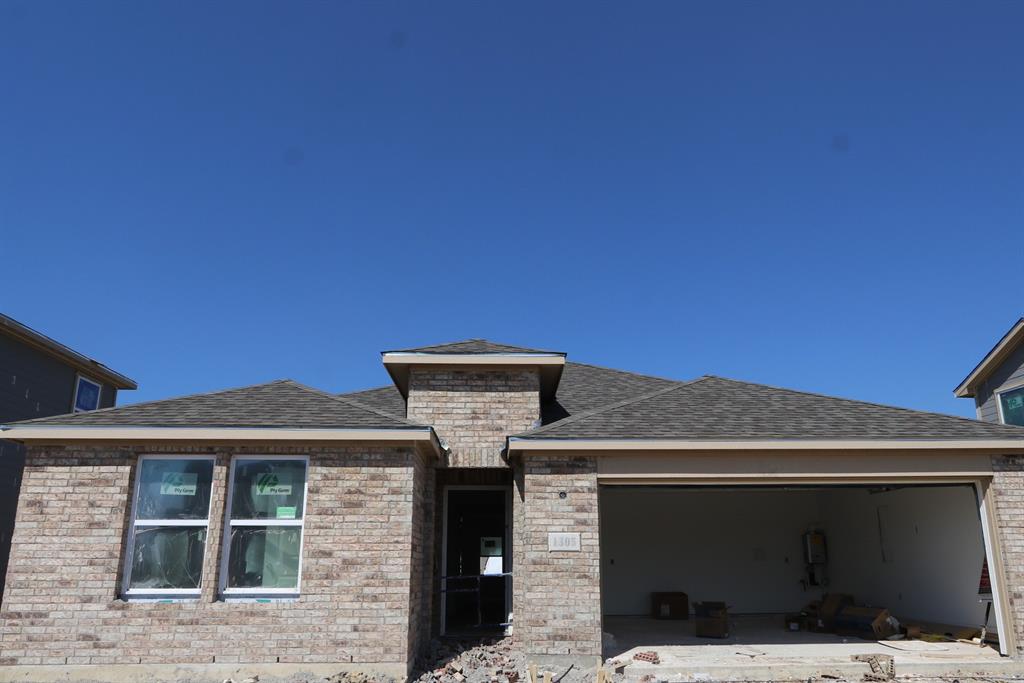 a front view of a house with a garage