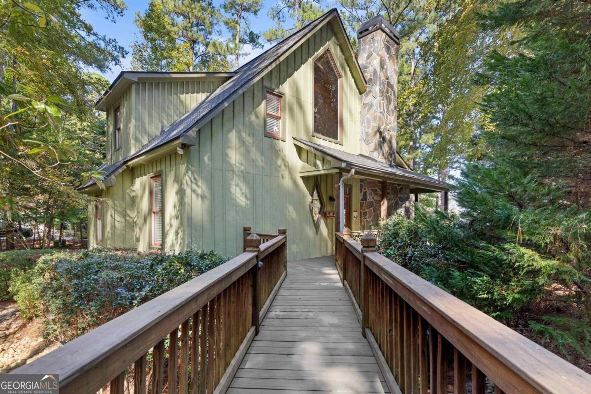 a view of a house with wooden stairs and a stairs