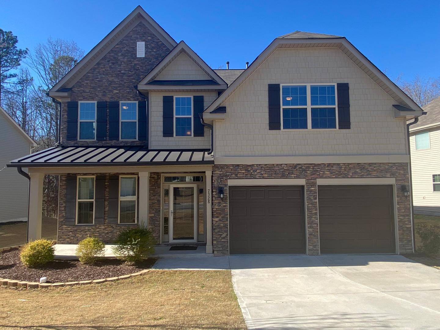 a front view of a house with yard