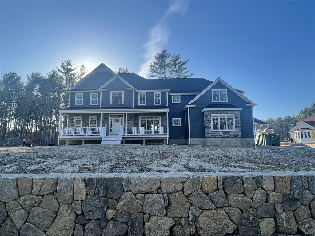 a view of a big house with a yard